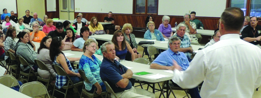 Current-Commissioner Chair Pat Fabian explains the process going into the Health Center decision September 15 during a town hall meeting at the Worthington-West Franklin Firehall.