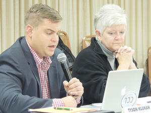 Ford City Borough Council Vice-President Tyson Klukan reads news that the municipality will receive a grant to help with flood mitigation.