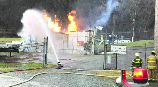 A half-dozen fire companies worked to keep flames at a natural gas compression station at-bay yesterday afternoon after the compressor inside exploded. Officials are investigating the cause (submitted photo)