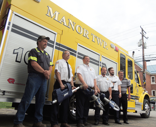 Manor Township Supervisors Bob Southworth and Don Palmer (on left and right ends) look at new fire rescue tools with (left to right) First Lieutenant John Breski, Fire Chief Chad Evans, Assistant Fire Chief Matt Klingensmith and Second Lieutenant Luke Linnon.
