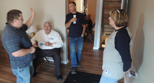 New homeowner Bobby Freuhstorfer gave Habitat volunteers a tour of the new home Monday evening.