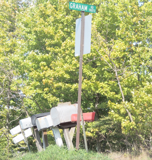 Graham Road in Bethel Township was full of Pennsylvania State Police officials early Monday morning after a warrant was filed for a man who tried to kill himself the night before. State Police also later found suspected improvised explosive devices (IEDs) in the residence belonging to Matt Strohm.