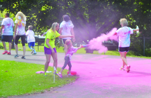 A West Hills student sprays someone in colored cornstarch during last year's Healthy Start 5K Color Run/Walk – coordinated through the West Hills PTO. The race will be held Sunday, Oct. 23.