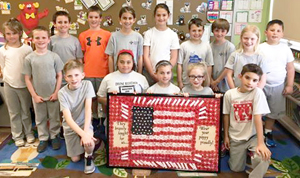 Mrs. Melisssa Sheaffer's third-grade class during the 2015-16 school year made an American flag out of poppy flowers for the national VFW contest and won first in Pennsylvania (photo used by permission)
