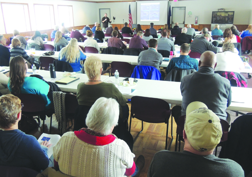 Certified Recovery Specialist Supervisor Mike Krafick talks in front of about 50 local residents yesterday at the second monthly Armstrong Drug Free Communities Coalition meeting. Meetings will be held the second Thursday of each month at the Belmont Complex in West Kittanning Borough.